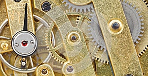 Background from brass mechanical clock movement