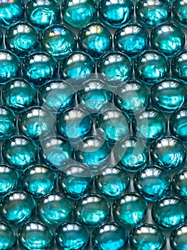 Background of bright, shiny glass stones, turquoise color