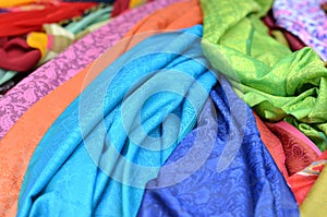 Background of bright silk cloths at Indian Market - blue, green