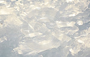 Background from broken pieces of ice. Texture, pattern, closeup