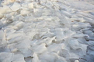 Background from broken pieces of ice. Texture, pattern, closeup