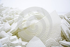 Background from broken pieces of ice. Texture, pattern, closeup
