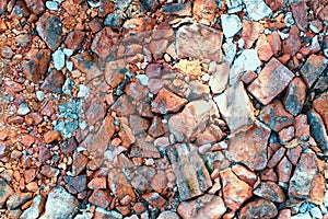 Background of broken red brick, close up