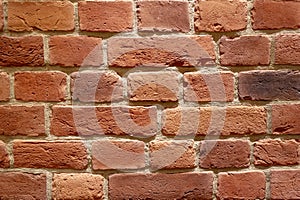 Background of brown building bricks. A wall of bricks