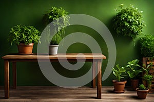 Background of a brown wooden table with potted plants and a green wall