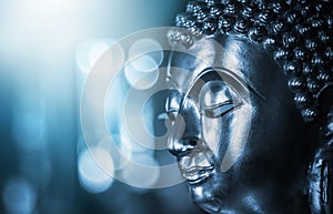 The background of the Buddha is energetic, mysterious and beautiful. Some Buddha images that emerge from darkness and light. Leave