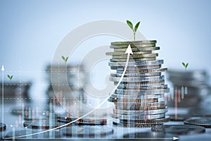 Background for business and finance with stacking of coins and plants growing on top. Savings and Accounts