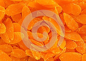 Background candied colorful fruit. Pineapple bits. candied fruit rows full frame closeup. Melon. Sweet Candied Fruit closeup. oran