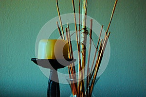 A background of a candle and vase