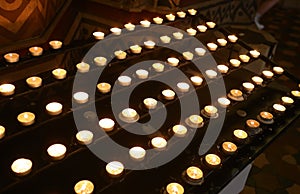 candles lit inside the place of worship by the faithful during the religious celebration
