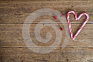 Background with candy canes in the shape of heart
