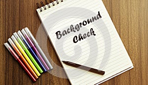 Background Check. your future target searching, a marker, pen, three colored pencils and a notebook for writing