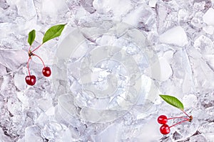 Background with cherry on ice cubes, top view