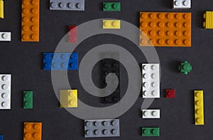 Background for children`s site, for the menu. Children`s constructors on black. Multi-colored cubes. Games for motor developing me