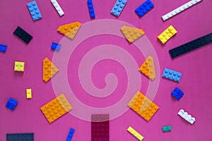Background for children`s site, for the menu. Children`s constructors on pink. Multi-colored cubes. Games for motor developing mem