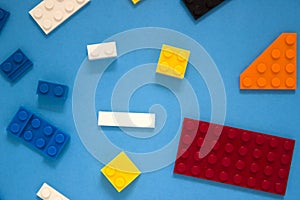 Background for children`s site, for the menu. Children`s constructors on blue. Multi-colored cubes. Games for motor developing m