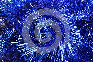 The background of Christmas tinsel blue