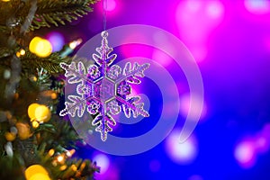 Background: A Christmas toy in the form of a star on a Christmas tree, against a background of colored beautiful bokeh. .Card and