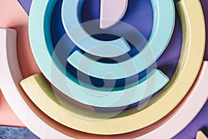 background with circles. Wooden kids toys on colourful paper. Educational toys blocks. Toys for kindergarten, preschool