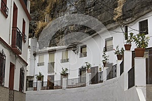 Background cityscape amazing white houses in the cliff in the village of Setenil de las Bodegas in Andalusia