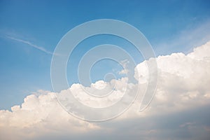 Background of the clear blue cerulean sky with big fluffy white cloud upon on it