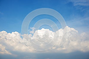 Background of the clear blue cerulean sky with big fluffy white cloud upon on it
