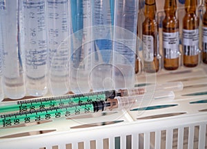 Background for clinics, hospitals, business, industry with syringes, ampoules and saline