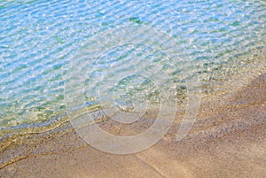 A background close up macro view of beautiful transparent clear soft sea wave at the beach, Baltic coast near St. Petersburg, Russ