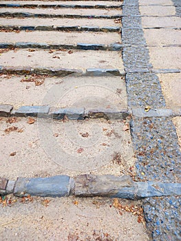 Background of cobblestones on the ground. Pavement stone texture. Granite cobblestone floor. Architecture and Constructions. Full