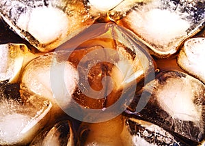Background of cola with ice and bubbles