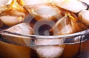 Background of cola with ice and bubbles