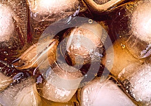 Background of cola with ice cubes and bubbles