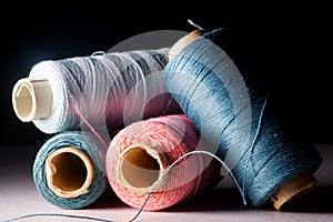 Background with colored sewing threads on spools