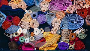 Background of colorful carpets rolled