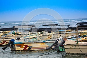 Background Colorful fishing boats and trawlers at a sea in Sri Lanka