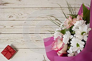 Background with colorful flowers on an old white wooden board