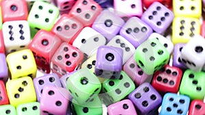 background of colorful gaming dice spinning on the rotating table