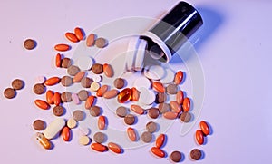 Background of colorful multi-vitamin pills, tablets and capsules