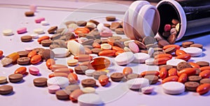 Background of colorful multi-vitamin pills, tablets and capsules