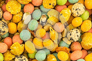 Background colorful nutty snack covered with sharp glaze wasabi shrimp yellow pink balls base menu bar snack beer