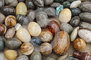 Background of colorful onyx stone eggs of different colors on a