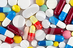 Background from colorful pills and capsules. Pharmaceutical industry concept. Pharmacy. Antibiotic resistance