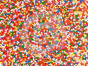 Background of colorful sprinkles, jimmies for cake decoration or photo