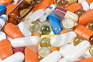 Background of colorful tablets, capsules, ampoules