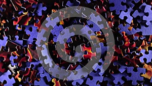 Background of coloured puzzle pieces that rotating counterclockwise