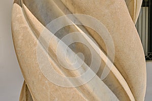Background column of a Catholic Church, close-up. Texture of a twisted spiral column
