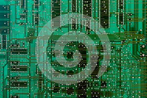 Background of computer circuit board closeup, green color texture