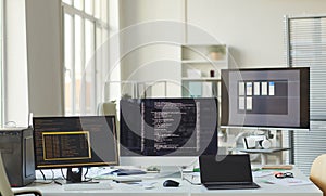 Background of Computers with Code on Screen in IT Office