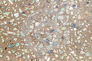 Background of concrete with colourful stones in it