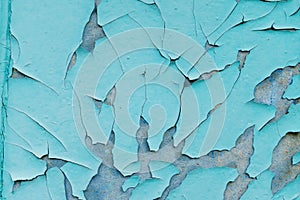 Background consisting of old blue green door with peeling paint